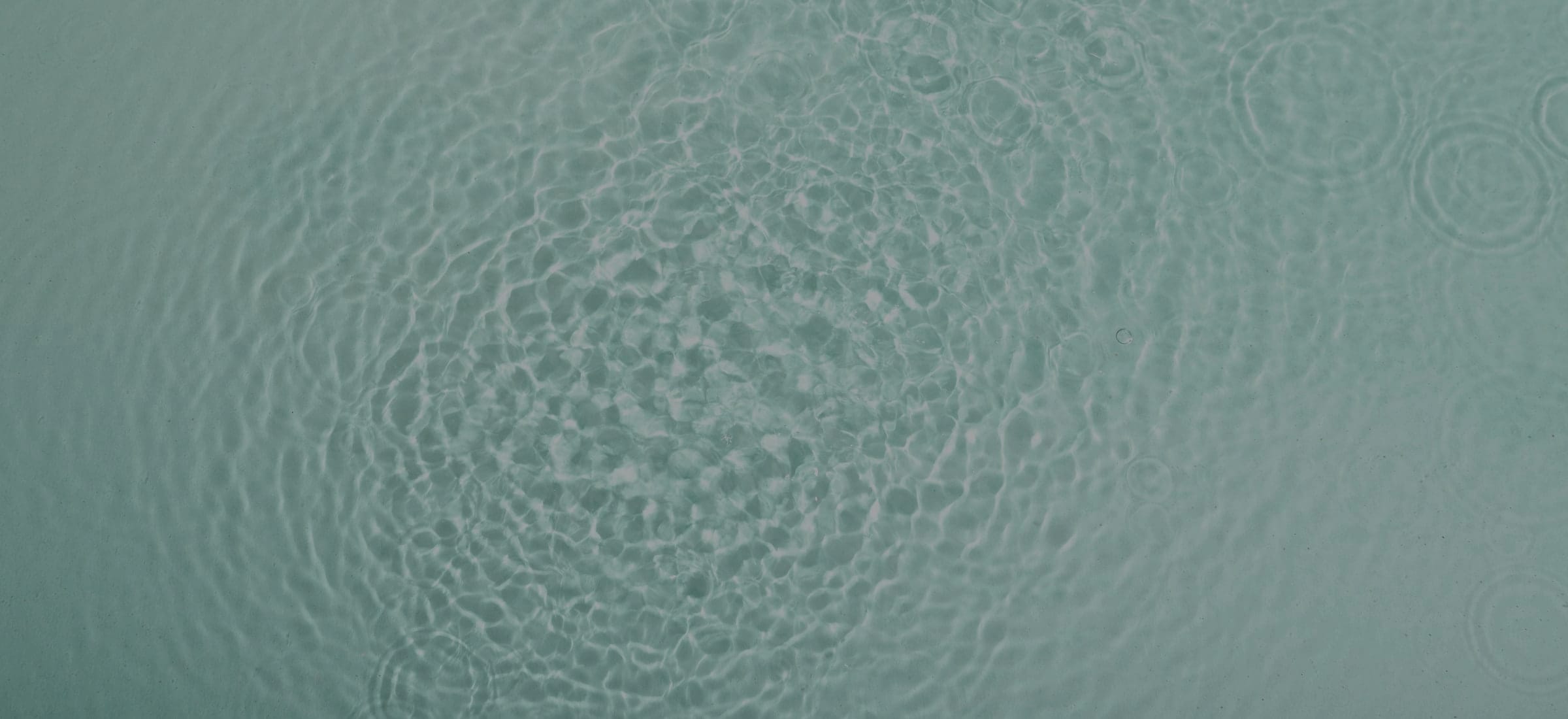 Flat water at slack tide, seen from above.